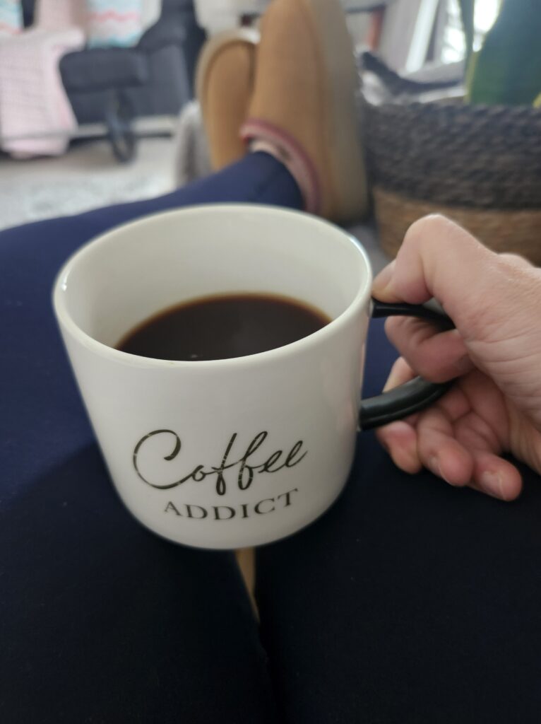 Relaxing on the couch with a cup of coffee